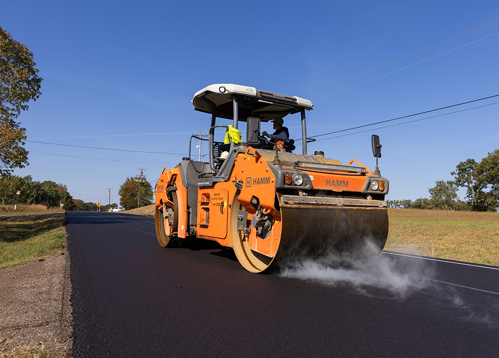 A vehicle paving the road